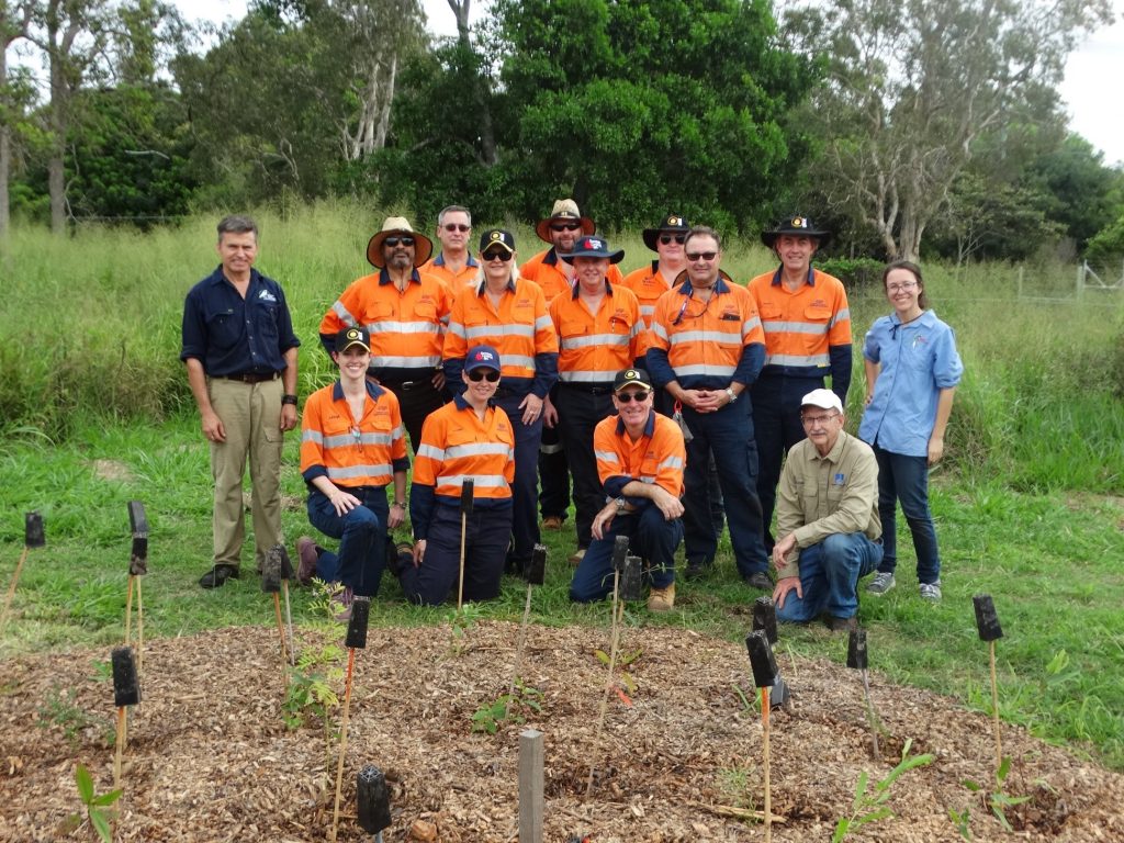 The Sunstate Cement volunteer team - planting trees for Earth Day 2019